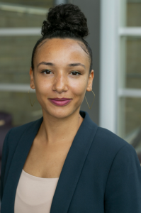 Photo of Prof. S. Lisa Washington. She is wearing a dark suit and her hair is in a bun.